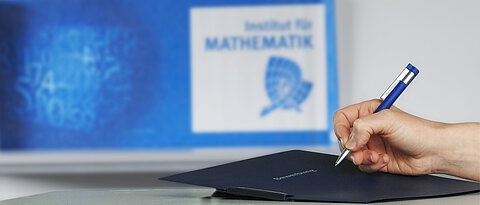Hand with ball pen and application folder
