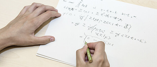 Handwritten notes and pen